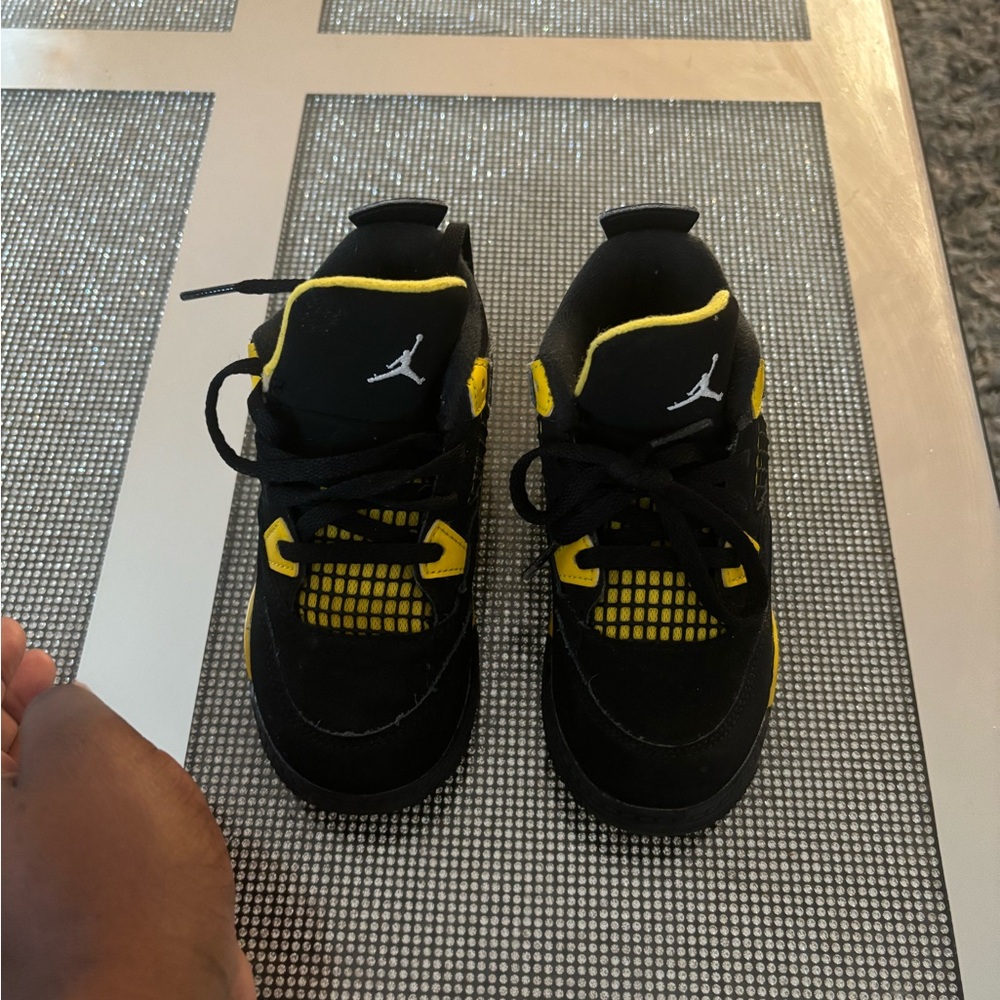 Retro Jordan Air 4 has been worn does have scuff Marks .